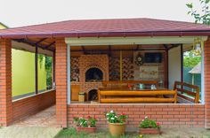 an outdoor kitchen is built into the side of a house