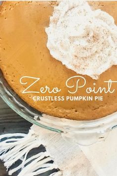 a close up of a pie on a plate with the words zero point crustless pumpkin pie