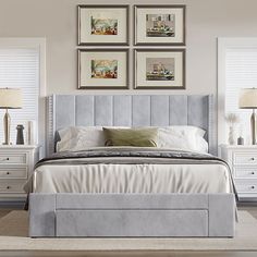 a bedroom with white furniture and pictures on the wall