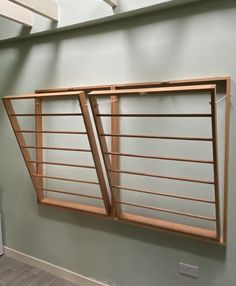 two wooden window frames hanging on the wall