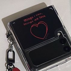 there is a cell phone case with a keychain attached to it that says things i like, things we love