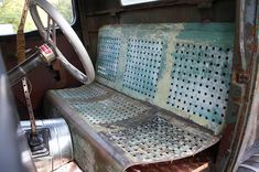 the interior of an old truck with rust