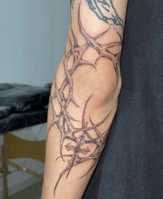 a man with a tattoo on his arm