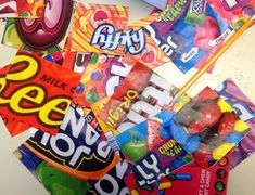 a pile of assorted candy on top of a table