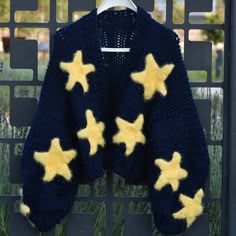 a blue sweater with yellow stars on it