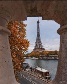 the eiffel tower is seen through an old window