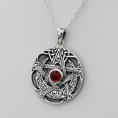 Both necklace chain and Moon Pentagram Pendant are made from nickel free .925 sterling silver.  No coatings, no plating, just sterling silver! This exquisite sterling silver Celtic Moon Pentacle Necklace is a stunning piece of jewelry, perfect for Wiccans, Pagans, Witches, and anyone seeking a unique and meaningful accessory. The beautifully polished pentagram is available with either an exceptional red garnet or rainbow moonstone gemstone, while the Celtic moon design adds a touch of mystical elegance. Created by renowned Pagan artist Paul Borda of Dryad Design, this beautiful Wicca necklace features a high-quality sterling silver construction. The pendant measures approximately 1" diameter and is nickel-free, ensuring comfort and durability. Whether you're celebrating a special occasion Wicca Necklace, Moon Pentagram, Witchcraft Jewelry, Pentacle Necklace, Moon Pentacle, Celtic Moon, Pentagram Necklace, Pentagram Pendant, Jewelry For Men