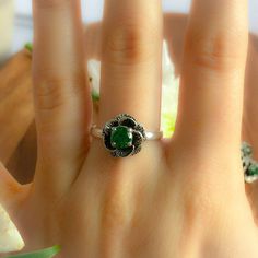 Flower Ring set with a Created Emerald in a diamond cut and flawless clarity & color (0.6 Carats). This vintage flower design is made of Solid 925 Sterling Silver (no “coating" ☞ only Solid Pure Silver - made to last) ⌛Last 2 Rings left ⌛ ☞ Choose your size ☞ I resize (before shipping) for FREE to Any size* Matching Set Available - Matching Earrings - please ask me. Details : ♥ Each item packaged in a cute GIFT BOX ✓ ♥ GUARANTEE on the materials ✓ ♥ Created Emerald in a perfect diamond cut & fla Green Flower-shaped Jewelry For Anniversary, Green Flower-shaped Anniversary Jewelry, Green Flower Shaped Anniversary Jewelry, Formal Green Flower-shaped Ring, Emerald Flower Jewelry For Gifts, Fine Jewelry May Birthstone Flower Ring, Green Oval Flower Ring For Gift, Fine Jewelry Round Flower Ring With May Birthstone, Elegant Flower Ring As Promise Ring With May Birthstone