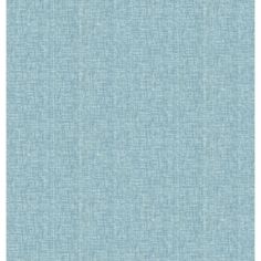 a light blue fabric textured background that looks like it has been washed or stained