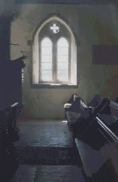 an old church with pews and a stained glass window