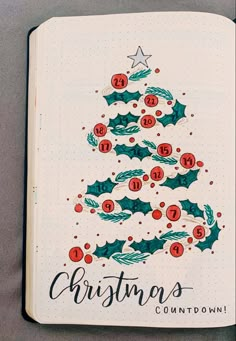 a christmas tree is drawn in a notebook