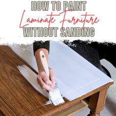 a person using a brush to paint laminate furniture with sanding paper on it