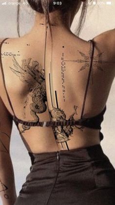 the back of a woman's body with tattoos on it