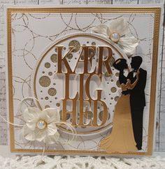 a close up of a greeting card with a bride and groom