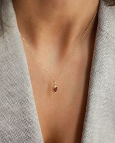 Description Elevate your jewelry collection with our Oval Ruby Pendant Necklace, a timeless piece signed for the woman who appreciates minimalist elegance. The necklace features a captivating oval-cut ruby, securely bezel set in 14k solid gold. With its clean lines and impeccable craftsmanship, this necklace effortlessly enhances any look, from formal to casual. Details * 4x6mm oval cut ruby * 14K solid gold * Chain length: 40cm + 3cm (16" + 1.18") * Ready to ship in 14K yellow gold Processing t Modern Oval Necklace For Anniversary, Minimalist Oval Gemstone Jewelry, Elegant Oval Pendant Birthstone Necklace, Dainty Yellow Gold Oval Birthstone Necklace, Fine Jewelry Oval Pendant Birthstone Necklace, Fine Jewelry Birthstone Necklace With Oval Pendant, Yellow Gold Oval Minimalist Necklaces, Minimalist Oval Yellow Gold Necklaces, Modern Oval Necklace With Polished Finish