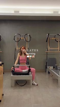 a woman sitting on a chair in front of a display of eyeglasses and other items