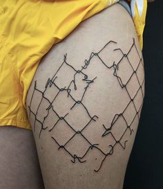 a man with barbed wire on his thigh