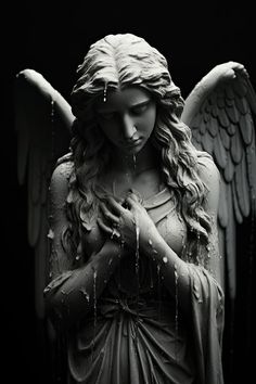 an angel statue with water dripping from her hands