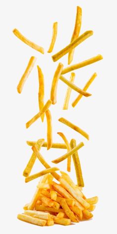 french fries falling into the air on a white background