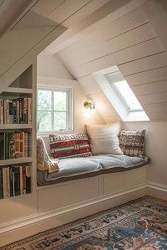 a window seat in the corner of a room with bookshelves on either side