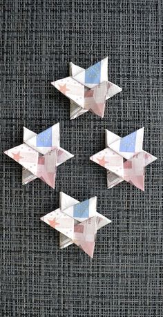 four origami birds sitting on top of each other