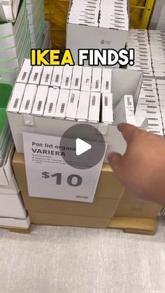 a person is pointing at some boxes on the shelf in front of them with words that read ikea finds