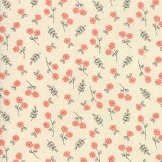 an orange and white flowered fabric with small pink flowers on it