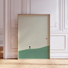 a framed photograph of a person on a golf course with a flag in the background