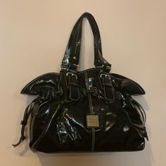 Dooney & Bourke Brand New Never Used Black Soft Patent Leather Bag Measures Approx H 11” X L 14” X D 6” Adjustable Straps Approx 9” Drop Magnetic Snap Closure One Zip Pocket One Slip Pocket Three Compartments Silver Hardware Dust Bag Great Roomy Bag For Travel, Cruise, Etc This Item Is Not Included In The Bundle Offer Medium Size Bags Handbags, Navy Handbag, Travel Cruise, Brown Satchel, Dooney & Bourke Bag, Patent Leather Bag, Patent Leather Handbags, Bag For Travel, Black Satchel