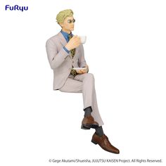 a figurine of a man in a suit holding a cup