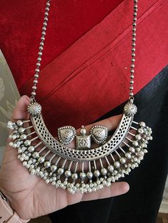 Antique silver replica necklace in Contemporary Look. Fusion Jewellery. Most demanding and liked necklace with beautiful color. Traditional Indian jewelry necklace. Add charm and charisma to your beautiful personality with these stunningly handcrafted silver look alike pendand necklace . Wear it with any of your formal or casual outfits and grab compliments all the way! Fusion Jewellery, Beautiful Personality, Traditional Indian Jewellery, Traditional Indian, Your Beautiful, Look Alike, Jewelry Necklace, Indian Jewelry, Antique Silver