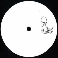 an alien sitting on top of a black and white disc with a small round hole in the middle