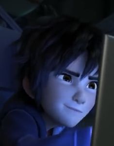 an animated image of a boy looking at a computer screen with eyes wide open in the dark