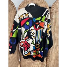 Beautiful sweater but does have a small stain, see photos. Armpit to armpit measures 23 inches and shoulder to bottom 30 inches. Oversized Retro Sweater, Retro Long Sleeve Sweater With Graphic Print, Multicolor Graphic Print Sweater For Fall, Retro Graphic Print Sweater For Fall, Oversized 90s Sweater With Graphic Print, Oversized 90s Graphic Print Sweater, Oversized Vintage Multicolor Tops, Vintage Fitted Sweater For Streetwear, Oversized Vintage Sweater With Graphic Print