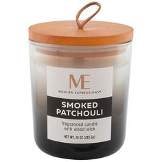 smoked patchouli candle with wood wick in a glass jar on a white background