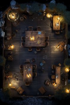 an overhead view of a table and chairs with lights in the middle, surrounded by rocks