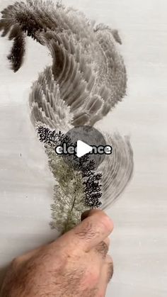 a hand holding a plant with the words elet nice on it and an image of a bird flying above