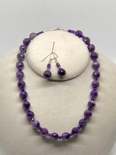 "Gorgeous 12mm Faceted Purple Cape Amethyst Beads with 5mm Amethyst Rondelle spacers in a hand beaded Necklace. Matching drop earrings with Sterling Silver Fancy French ear wires. All Sterling Silver (.925) Lobster Clasp and Findings. All handcrafted and hand wire wrapped. A shorter necklace at 18 inches that includes a 3 inch Sterling Silver Extender for a total length of 21 inches. Lays beautifully on the nape of the neck. Elegant and Classic Styling. Wear for any occasion, an evening out or c Lavender 8mm Beads Jewelry For Healing, Purple Amethyst Necklace With 8mm Beads, Purple Round Bead Gemstones For Gifts, Lavender Amethyst Crystal Necklaces With Round Beads, Purple Amethyst Bead Jewelry, Lavender Round Jewelry With Faceted Beads, Purple Amethyst Jewelry With Polished Beads, Beaded Amethyst Jewelry With Round Beads, Purple Faceted Bead Necklaces