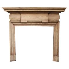 an antique fireplace mantel made of wood