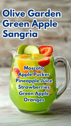 a green apple sangria with strawberries and apples in it