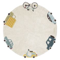 a round rug with cars and trucks on it