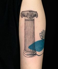 a woman's arm with a tattoo on it