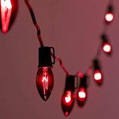 red christmas lights are hanging from the ceiling