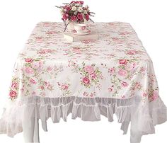 a white table with pink flowers on it