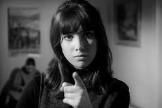 black and white photograph of a woman giving the thumbs up sign