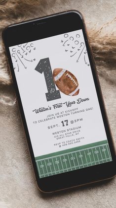 an iphone with a football themed first birthday party on the screen