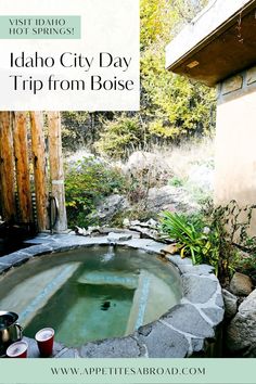 the jacuzzi tub is surrounded by rocks and plants, with text overlay that reads idaho city day trip from boise