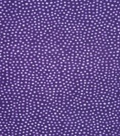 a purple background with white polka dots