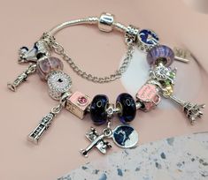 Travel Theme Pandora style bracelet, Travel charm bracelet , travel adventure charm bracelet - travel charm jewelry, travel, passport, world gift , Eifel tower, Paris suitcase, camera, blue ,pink, Pandora Paris Charm, Pandora Travel Charms, Pandora Travel, Travel Charm Bracelet, Pandora Bracelet Charms Ideas, Pandora Style Bracelet, Luxe Aesthetic, 17 Birthday, Photo Bleu