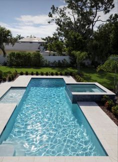 an empty swimming pool in the middle of a yard